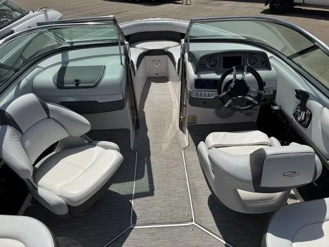 Slide: The Image of 2014 Regal 2300 boat interior with modern dashboard and comfortable seating. - 10