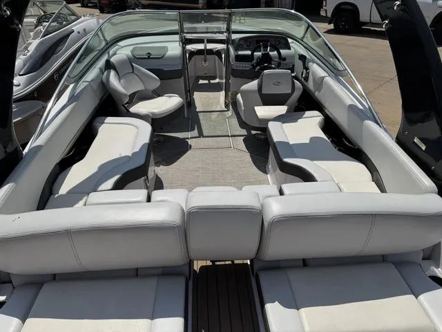 Slide: The Image of 2014 Regal 2300 boat interior with spacious seating and modern dashboard. - 11