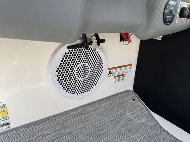 Slide: The Image of 2014 Regal 2300 boat interior with speaker and control panel. - 14