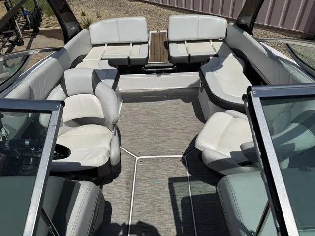 Slide: The Image of 2014 Regal 2300 boat interior with white seating and open layout. - 6