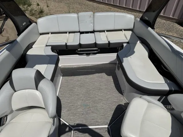 Slide: The Image of 2014 Regal 2300 boat interior with spacious white seating and modern design. - 7