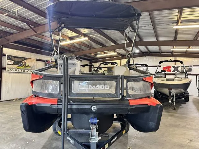 Slide: The Image of 2023 Sea-Doo Switch Sport Compact-170 hp boat in a showroom, rear view. - 3