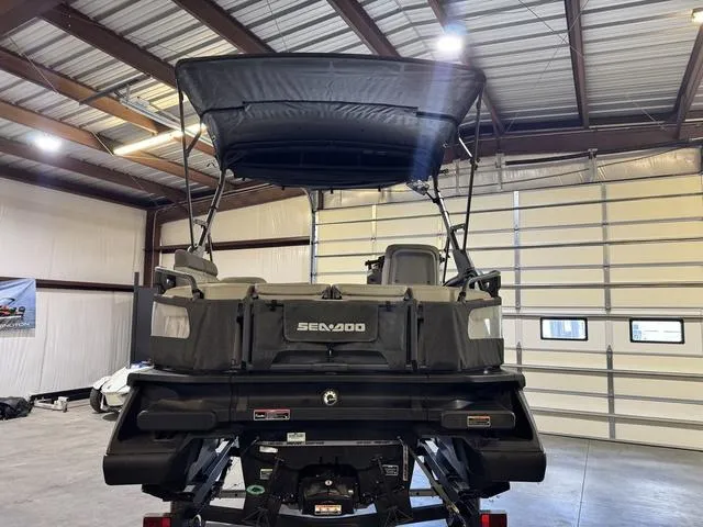 Slide: The Image of 2023 Sea-Doo Switch® Sport Compact-170 hp in a garage, rear view with canopy. - 7