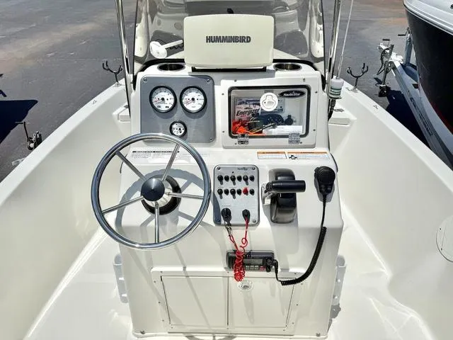 Slide: The Image of 2012 NAUTIC STAR 1810 CC boat console with steering wheel and Humminbird electronics. - 5