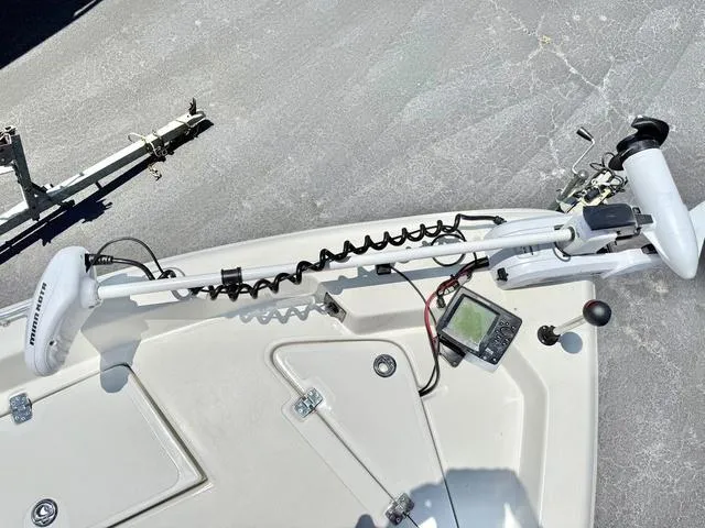 Slide: The Image of 2012 NAUTIC STAR 1810 CC boat deck with trolling motor and fish finder. - 7