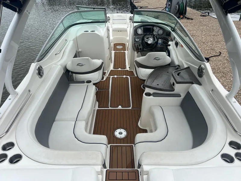 Slide: The Image of 2011 Rinker 276 Captiva Bowrider with spacious seating and elegant wood flooring. - 19