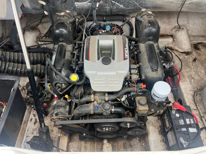 Slide: The Image of Engine compartment of a 2011 Rinker 276 Captiva Bowrider, featuring a MerCruiser 350 engine. - 35