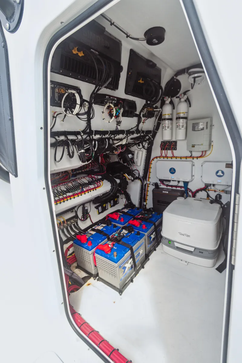 Slide: The Image of Interior view of a 2022 Freeman 34VH boat's electrical and mechanical systems. - 14