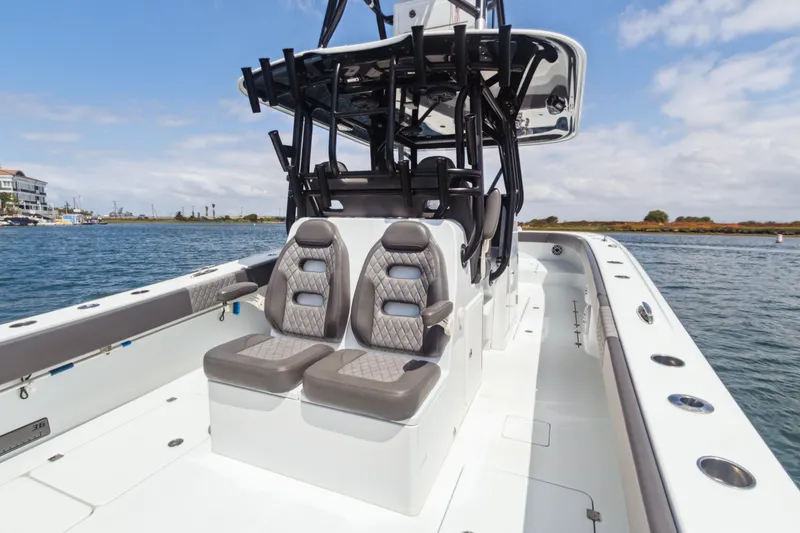 Slide: The Image of 2022 Freeman 34VH boat interior with dual seats on open water. - 16