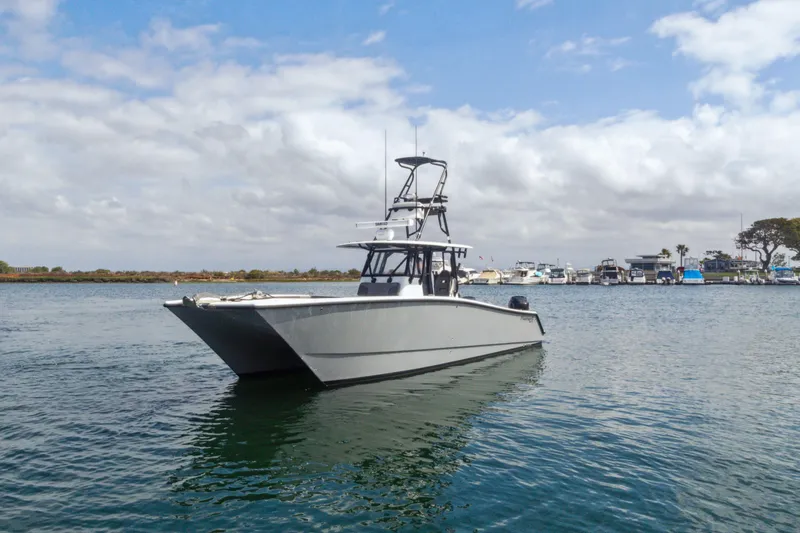 Slide: The Image of 2022 Freeman 34VH boat on calm water with cloudy sky background. - 19