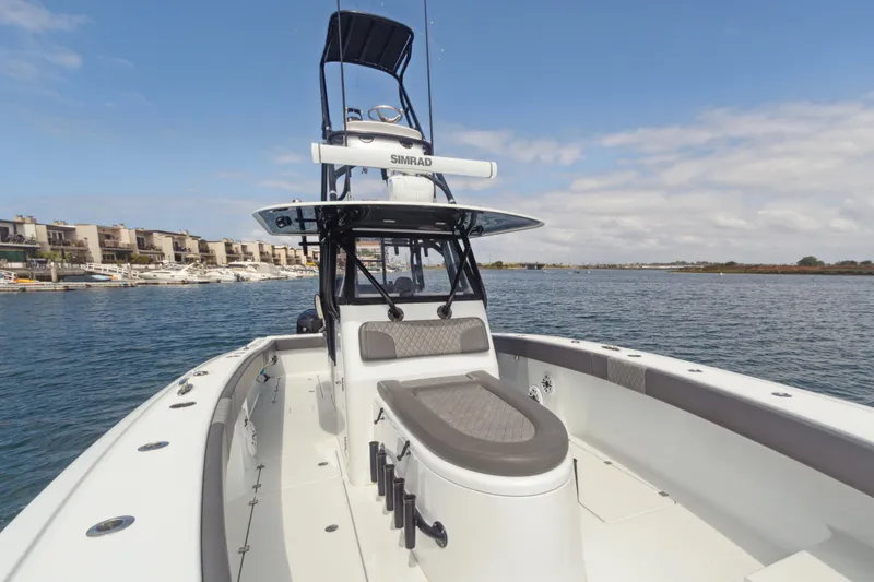 Slide: The Image of Freeman 34VH 2022 boat on water, featuring modern design and spacious deck. - 2