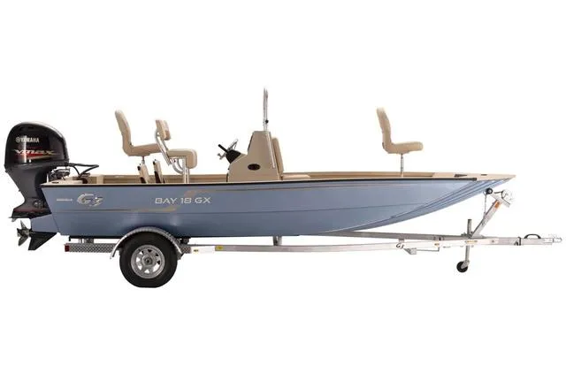 Slide: The Image of 2023 G3 BAY 18T GX boat interior with beige seating and steering console. - 5