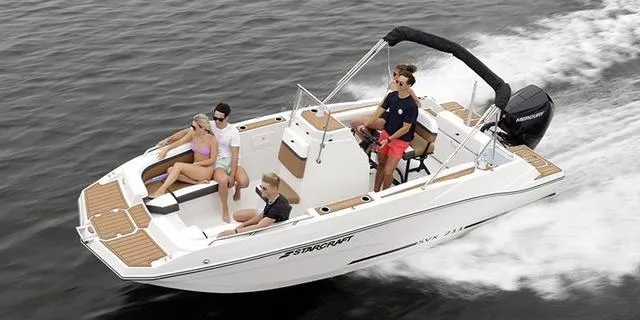 Slide: The Image of 2024 Starcraft SVX 211 CC boat cruising with passengers on a lake. - 1