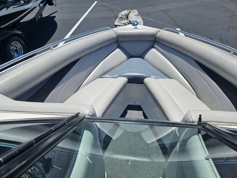 Slide: The Image of 1992 MasterCraft Prostar 205 boat interior with gray seating and sleek design. - 10