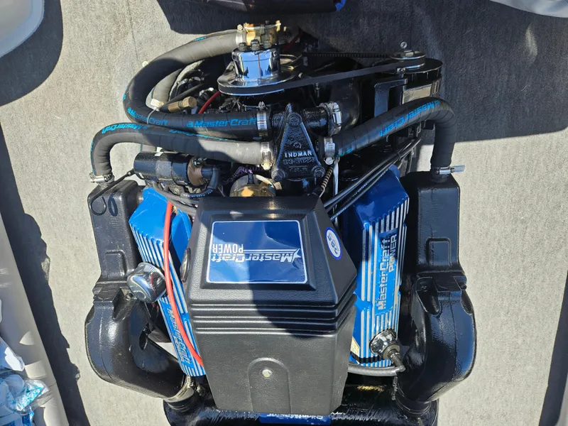 Slide: The Image of 1992 MasterCraft Prostar 205 engine, showcasing detailed components and blue accents. - 12