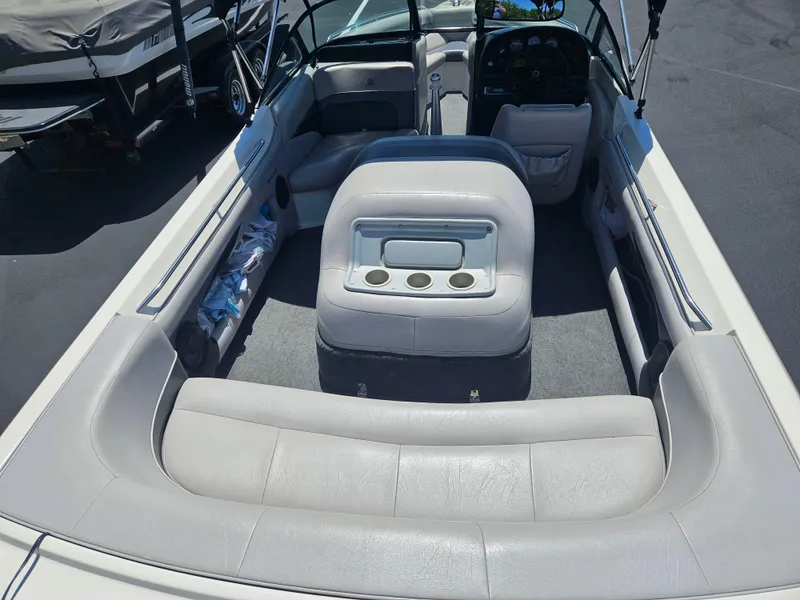 Slide: The Image of 1992 MasterCraft Prostar 205 boat interior with gray seating and cup holders. - 4