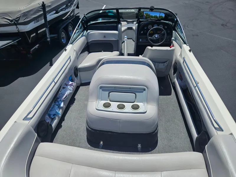 Slide: The Image of 1992 MasterCraft Prostar 205 boat interior with seating and steering wheel. - 5