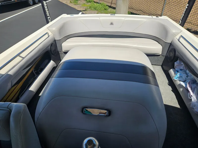 Slide: The Image of 1992 MasterCraft Prostar 205 boat interior with gray seating and sleek design. - 6