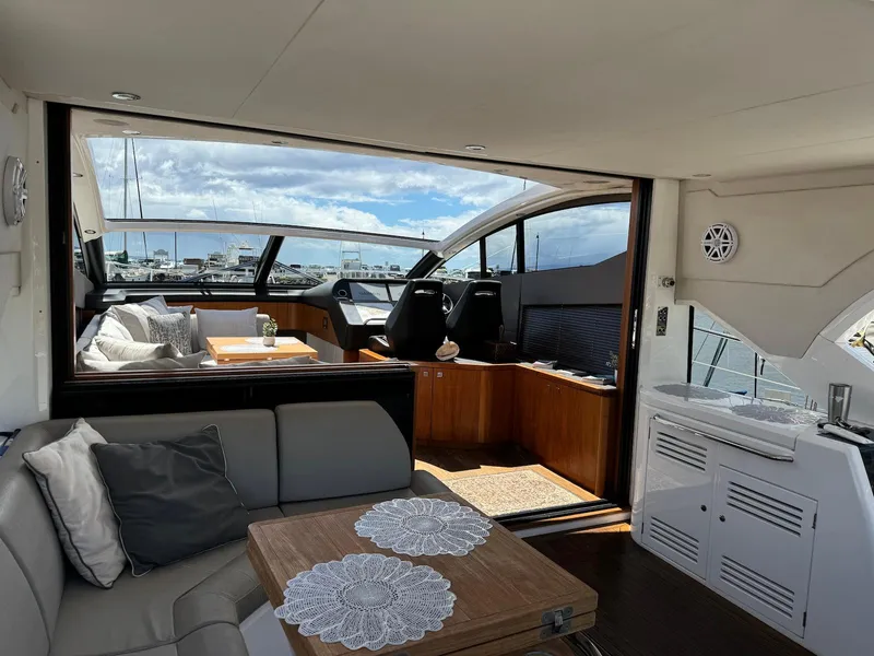 Slide: The Image of Luxurious interior of 2017 Sunseeker Predator 57 yacht with elegant seating and helm station. - 12