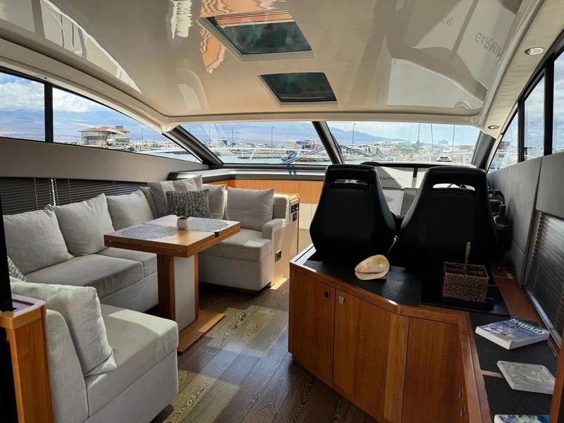 Slide: The Image of Luxurious interior of 2017 Sunseeker Predator 57 yacht with plush seating and panoramic windows. - 13