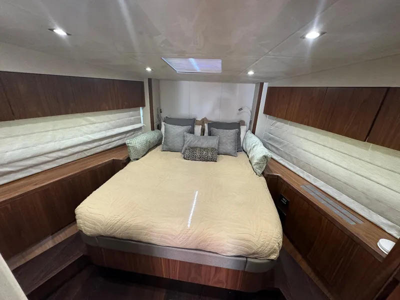 Slide: The Image of Luxurious bedroom interior of 2017 Sunseeker Predator 57 yacht with cozy bedding and ambient lighting. - 20