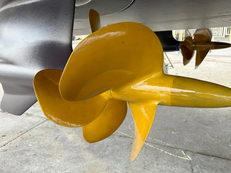Slide: The Image of Close-up of a yellow propeller on a 2017 Sunseeker Predator 57 yacht. - 27