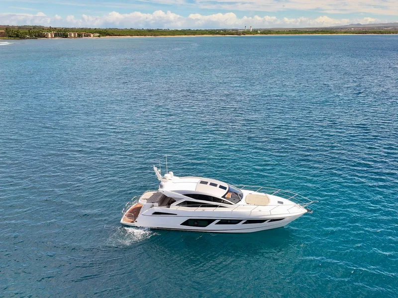 Slide: The Image of 2017 Sunseeker Predator 57 yacht cruising on clear blue ocean waters. - 6