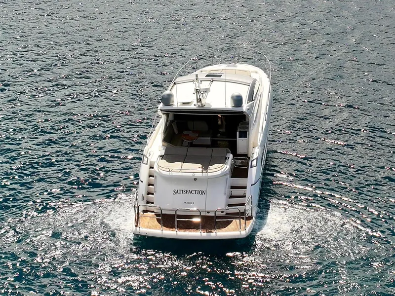 Slide: The Image of 2017 Sunseeker Predator 57 yacht cruising on open water, rear view. - 8