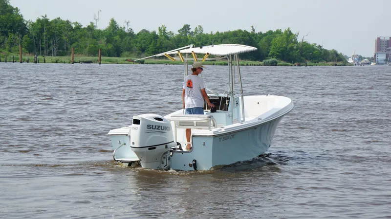 Slide: The Image of 1998 Sea Ox 20'6" boat with Suzuki outboard motor on a calm river. - 5