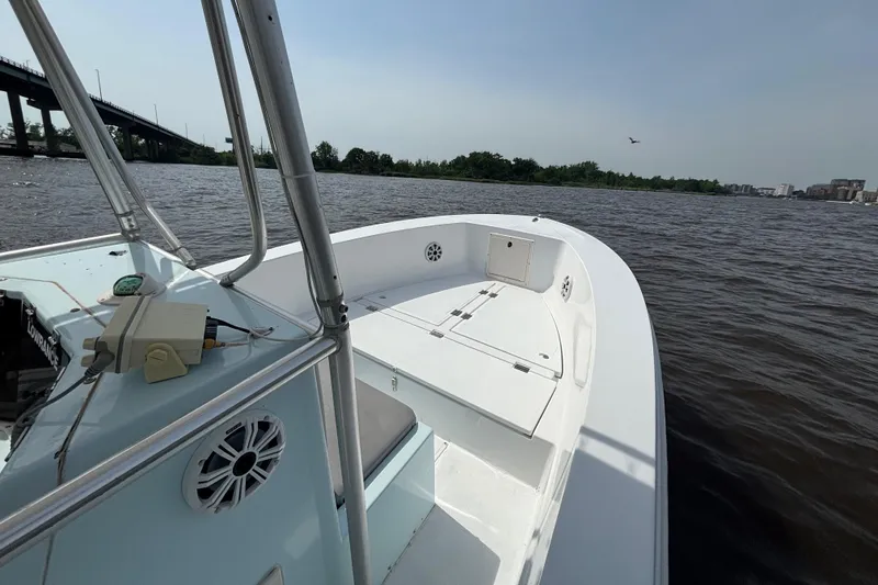 Slide: The Image of 1998 Sea Ox 20'6" boat on a river, clear sky, bridge in background. - 8