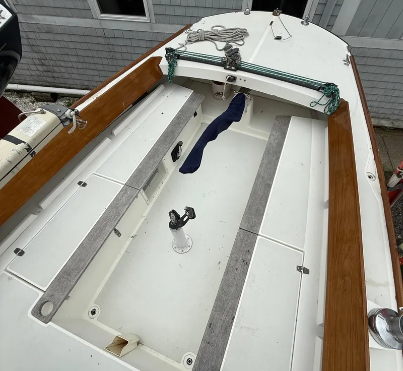 Slide: The Image of Alerion Express 28 sailboat cockpit, 1997 model, with wooden trim and clean deck layout. - 4