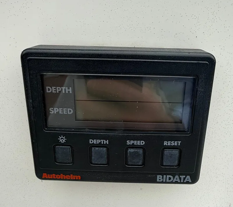 Slide: The Image of Autopilot display on 1997 Alerion Express 28, showing depth and speed settings. - 8