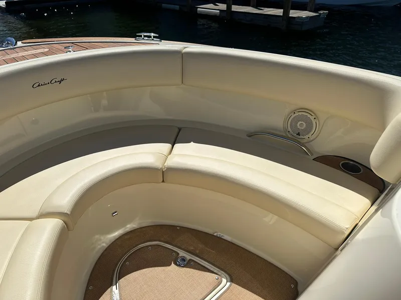 Slide: The Image of 2016 Chris-Craft Launch 28 boat interior with cream leather seating and speaker. - 18
