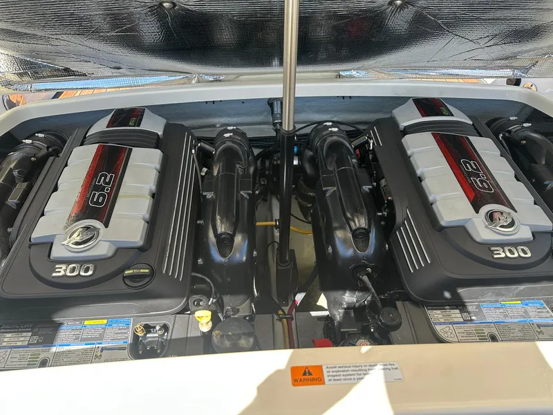 Slide: The Image of Twin engines of a 2016 Chris-Craft Launch 28 boat, showcasing 6.2L 300 horsepower. - 26