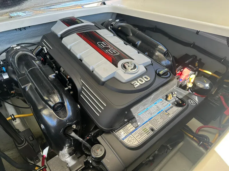 Slide: The Image of 2016 Chris-Craft Launch 28 engine compartment with a powerful 300 horsepower engine. - 28