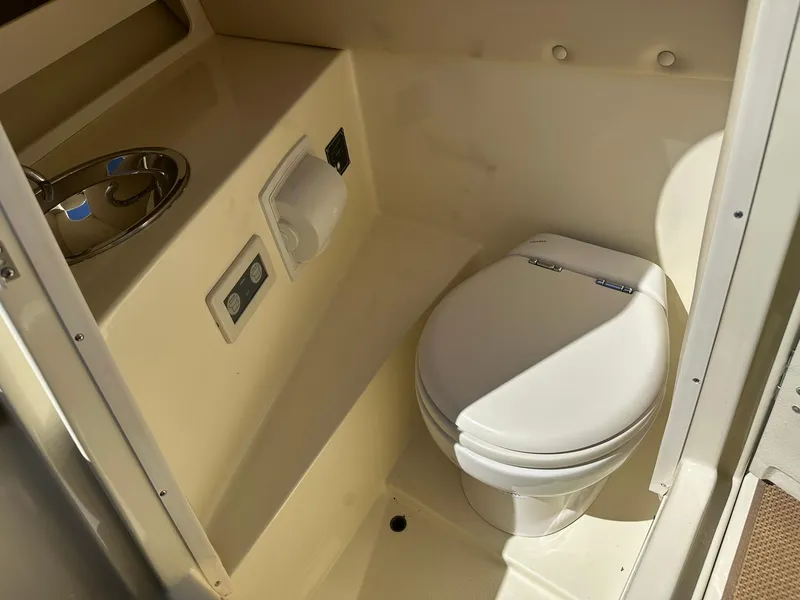 Slide: The Image of 2016 Chris-Craft Launch 28 boat bathroom with toilet and sink. - 29