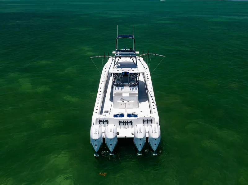 Slide: The Image of 2021 Freeman 42 LR boat on clear green water, aerial view. - 18