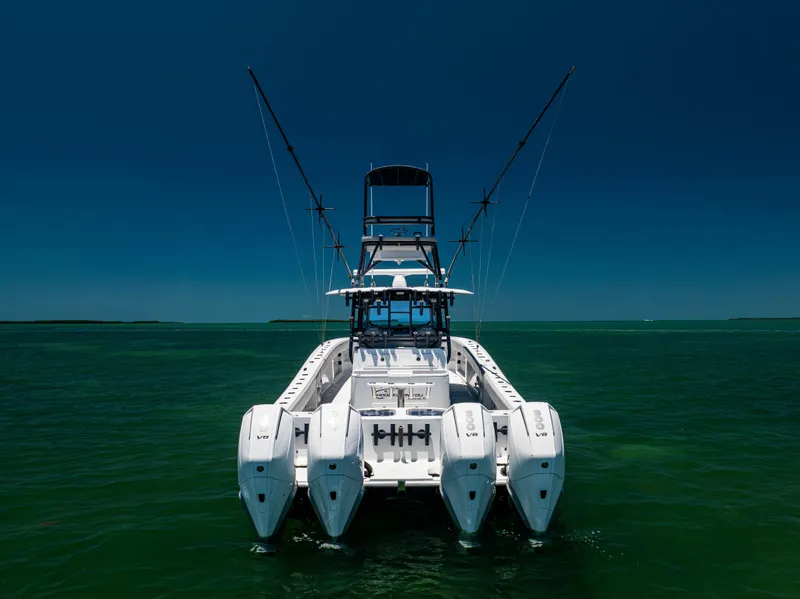 Slide: The Image of 2021 Freeman 42 LR boat with multiple engines on open water. - 19