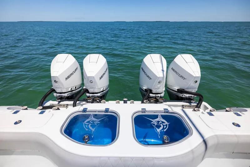 Slide: The Image of Four Mercury outboard engines on a 2021 Freeman 42 LR boat, ocean backdrop. - 21