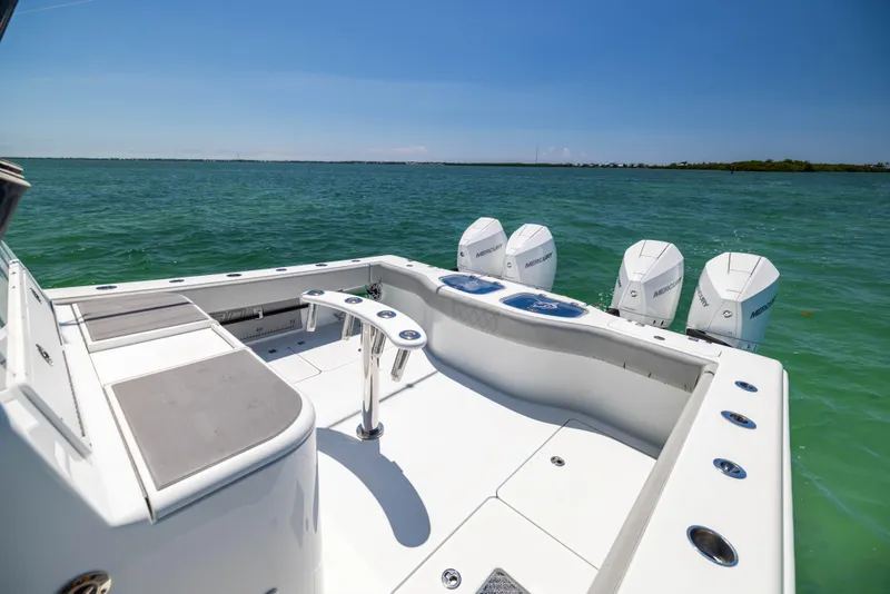 Slide: The Image of 2021 Freeman 42 LR boat with four engines on open water. - 25