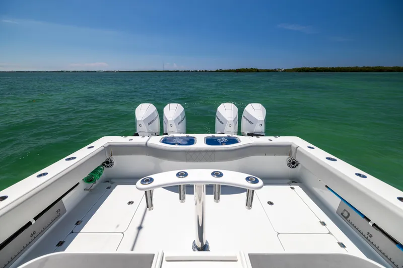 Slide: The Image of 2021 Freeman 42 LR boat with quad engines on open water. - 26