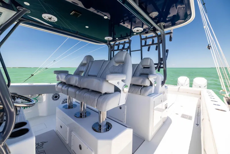 Slide: The Image of Luxury seating on 2021 Freeman 42 LR boat with ocean backdrop. - 32