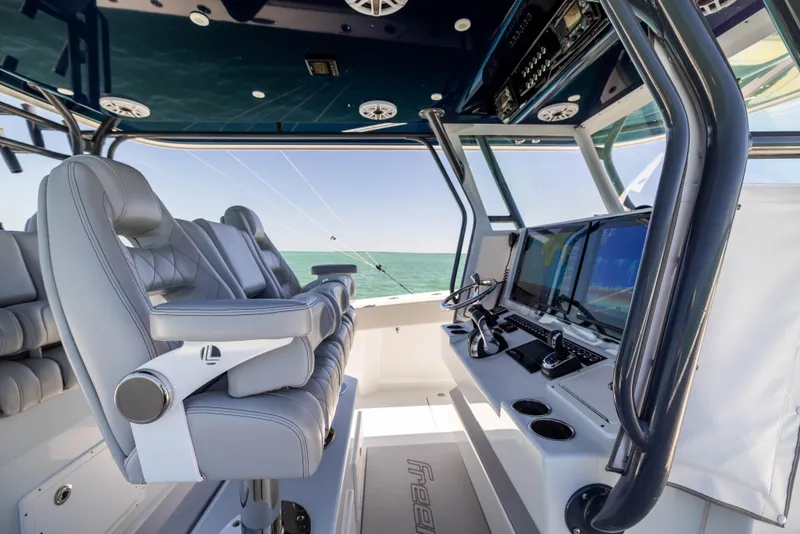 Slide: The Image of Interior of a 2021 Freeman 42 LR boat with modern navigation equipment and seating. - 34