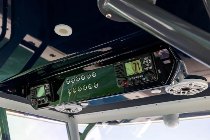 Slide: The Image of 2021 Freeman 42 LR boat console with electronic controls and speakers. - 37