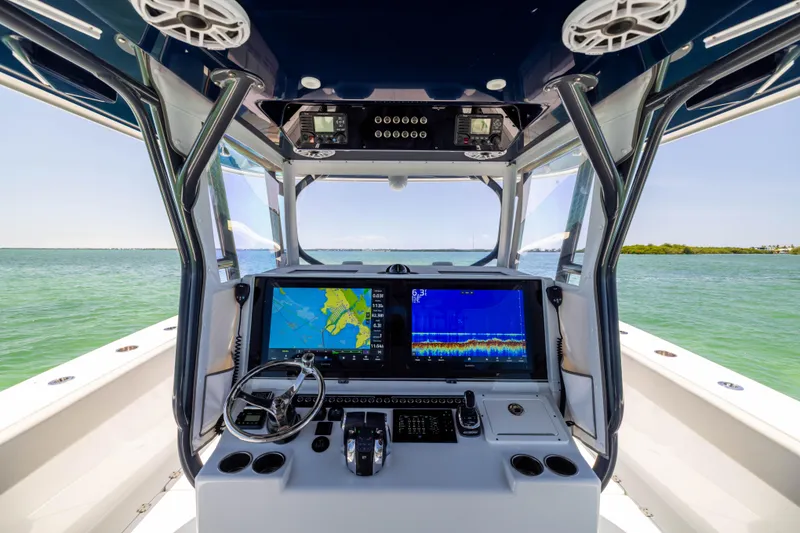 Slide: The Image of Cockpit view of 2021 Freeman 42 LR boat with advanced navigation system. - 38
