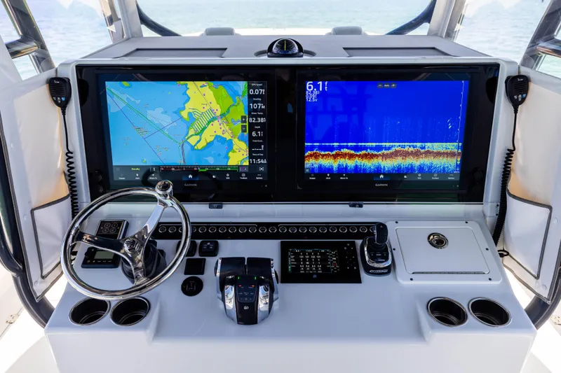 Slide: The Image of Freeman 42 LR 2021 boat dashboard with navigation and sonar displays. - 39