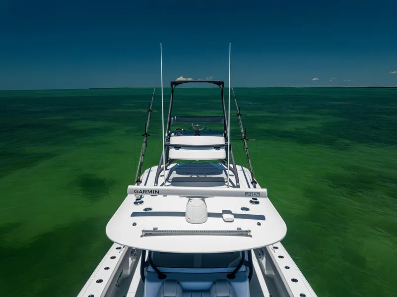 Slide: The Image of 2021 Freeman 42 LR boat on clear green water under blue sky. - 4