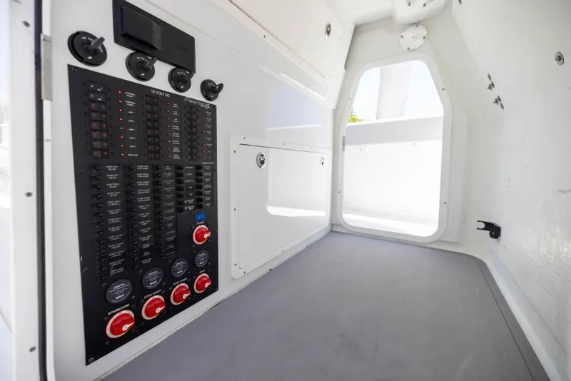 Slide: The Image of Interior of a 2021 Freeman 42 LR boat showing control panel and storage area. - 40