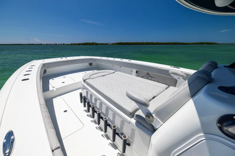 Slide: The Image of 2021 Freeman 42 LR boat with spacious seating, rod holders, and ocean view. - 42
