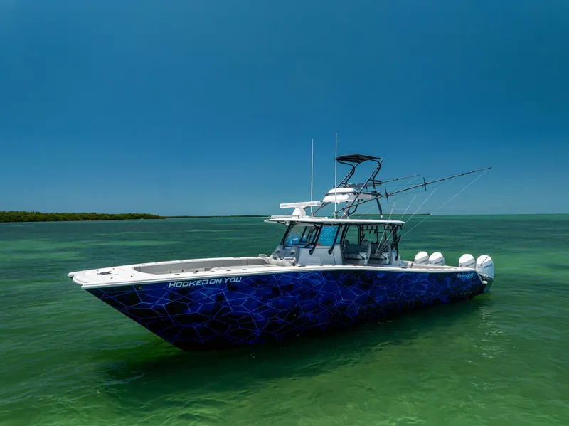 Slide: The Image of Freeman 42 LR 2021 boat on clear water under blue sky. - 5
